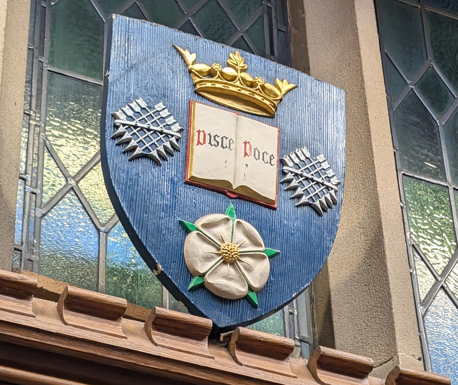 Coat of Arms of the University of Sheffield showing shields and the white rose